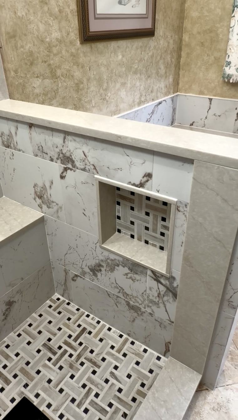 Marble tile wall with woven mosaic accent niche